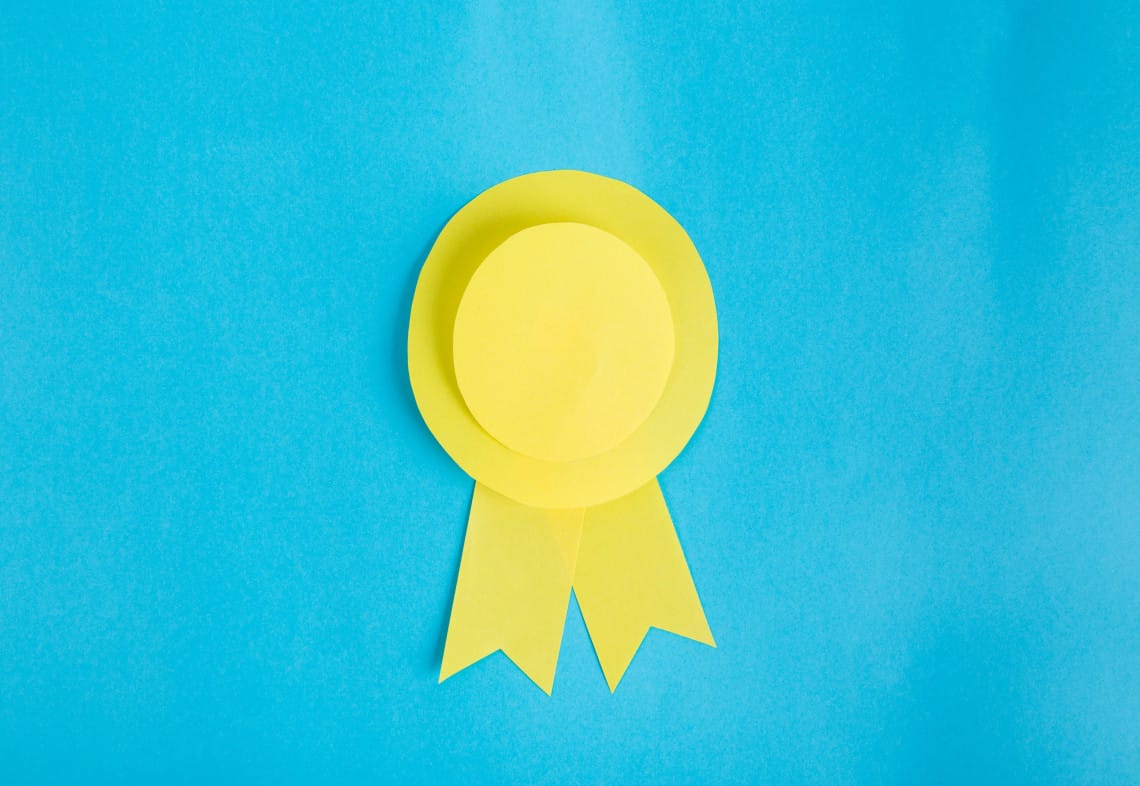 a yellow ribbon is on a blue background